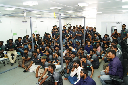 staff sitting floor in factory