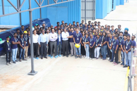 agnikul team standing in rocket factory